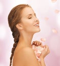 Beautiful woman with rose petals Royalty Free Stock Photo