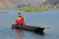 Beautiful Manipuri woman rowing canoe in Loktak lake