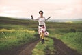 Beautiful woman running on a countryside road Royalty Free Stock Photo