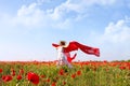 Beautiful woman running in poppy field Royalty Free Stock Photo