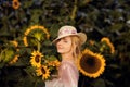 Beautiful woman in a rural field scene outdoors, with sunflowers Royalty Free Stock Photo