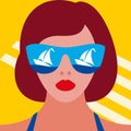 Beautiful  woman`s face in mirror sunglasses with sea and yacht reflection on the glasses. Hot girl on the beach. Royalty Free Stock Photo