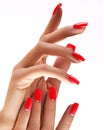 Beautiful woman`s hands on light background. Care about hand. Redl manicure, clean skin. Bright nails with polish