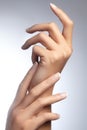 Beautiful woman`s hands on light background. Care about hand. Tender palm. Natural manicure, clean skin. French nails