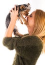 Beautiful woman's Yorkshire terrier dog gives kisses