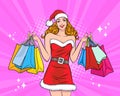 Beautiful woman Santa Claus with shopping bag