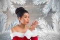 Beautiful woman in santa costume blowing snow flakes Royalty Free Stock Photo