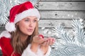 Beautiful woman in santa costume blowing snow flakes Royalty Free Stock Photo