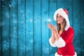 Beautiful woman in santa costume blowing snow flakes Royalty Free Stock Photo