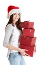 Beautiful woman in santa hat holding presents. Royalty Free Stock Photo