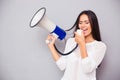 Beautiful woman screaming on megaphone Royalty Free Stock Photo