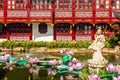 Beautiful woman sculpture in the pond of Yuyuan garden in old Shanghai, China. Summer sunny day Royalty Free Stock Photo