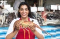 Beautiful woman selling seafood on a latin fish market Royalty Free Stock Photo