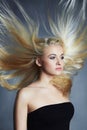 Beautiful woman. blond girl.healthy hair.Beauty salon.flying hair Royalty Free Stock Photo