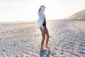 Beautiful young woman in swimsuit on beach