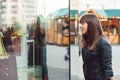 Beautiful woman with shopping bags looking at the shop window Royalty Free Stock Photo