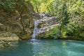 Beautiful woman is showering in the hidden waterfalls of Serik region in Antalya