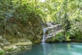 Beautiful woman is showering in the hidden waterfalls of Serik region in Antalya