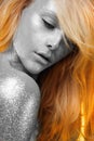 Girl with Silver skin and orange Hair