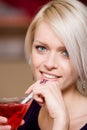 Beautiful woman sipping a martini Royalty Free Stock Photo