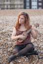 Woman playing ukulele