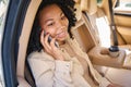 Beautiful woman sits in the back passenger seat Royalty Free Stock Photo