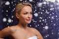 Beautiful woman sitting in bath towel at sauna Royalty Free Stock Photo