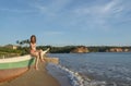 Beautiful woman sitting at the boat on the beach in Weligama Royalty Free Stock Photo