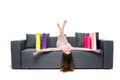 Beautiful woman sitting on couch with many shopping bag around acting joyful and happy with arms spread wide