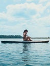 beautiful woman sitting down on the supboard