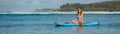 Beautiful woman sitting on sup