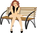 Beautiful woman sitting on the wooden bench