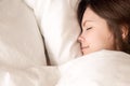 Beautiful woman sleeping in cozy bed, closeup headshot top view Royalty Free Stock Photo