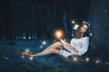 Beautiful woman sleeping among fairies Royalty Free Stock Photo