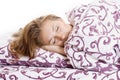 Beautiful woman sleeping and smiles in his sleep in bed Royalty Free Stock Photo