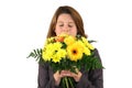 Beautiful woman smelling at a bunch of flowers Royalty Free Stock Photo