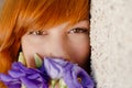 Beautiful woman smelling purple chinese rose