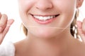 Beautiful woman smile with dental floss, happy face