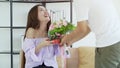 Beautiful woman smiling with flowers and gift surprise Valentine Royalty Free Stock Photo