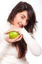 Beautiful woman smiling with a green apple on hands