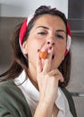 Beautiful woman smoking a carrot