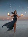 Beautiful woman sorceress holding fire in her hands. Art photo Fantasy model with flaming arms casts spell. Girl battle Royalty Free Stock Photo