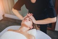 Beautiful woman in spa salon getting facial massage Royalty Free Stock Photo