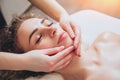 Beautiful woman in spa salon getting facial massage Royalty Free Stock Photo