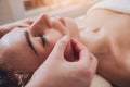 Beautiful woman in spa salon getting facial massage Royalty Free Stock Photo