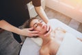 Beautiful woman in spa salon getting facial massage Royalty Free Stock Photo