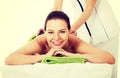 Beautiful woman on spa salon having stone massage. Royalty Free Stock Photo