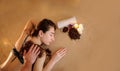 Beautiful woman in spa salon having spa therapy with coffee done by a masseur