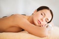 Beautiful woman in spa salon with hot stones Royalty Free Stock Photo