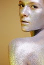 Beautiful Woman with Sparkles on her Face and body Royalty Free Stock Photo